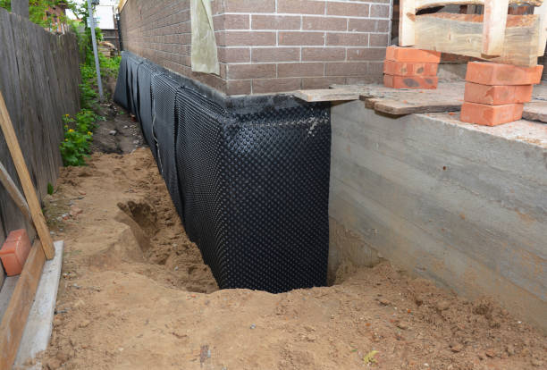 SJ Waterproofing Pros technician performing targeted Basement Waterproofing assessment in Sterling Heights, MI